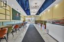 Contemporary interior featuring white marble-look flooring and a recessed ceiling with exposed ductwork - 5 Manitou Drive Unit# 106B, Kitchener, ON 