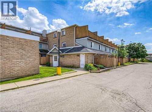Brick and siding exterior with pitched shingle roofing - 67 Valleyview Road Unit# 58, Kitchener, ON - Outdoor