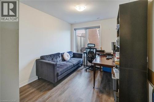 Room with wood-finish flooring, white baseboards, and neutral wall paint - 2635 William Jackson Drive Unit# 705, Pickering, ON - Indoor