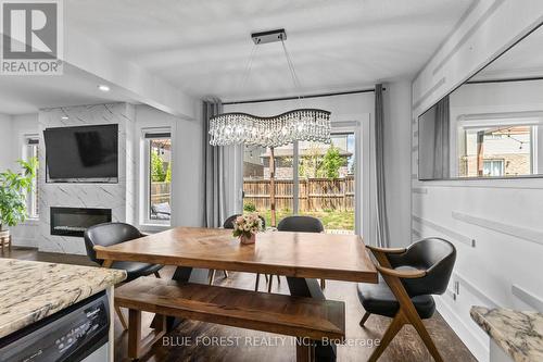 3293 Casson Way, London South (South W), ON - Indoor Photo Showing Dining Room With Fireplace