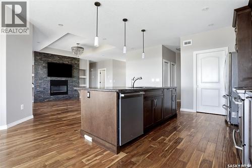701 Saskatoon Drive, Katepwa Beach, SK - Indoor Photo Showing Kitchen With Fireplace With Upgraded Kitchen
