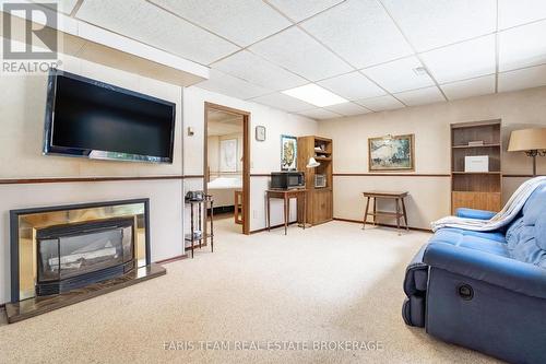 21 Pooles Road, Springwater, ON - Indoor With Fireplace