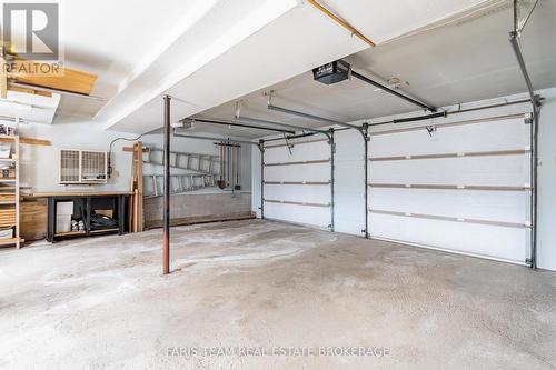 21 Pooles Road, Springwater, ON - Indoor Photo Showing Garage