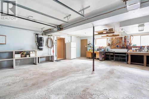 21 Pooles Road, Springwater, ON - Indoor Photo Showing Garage