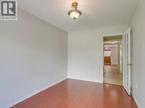 Interior room featuring wood-finish flooring and light gray painted walls - 1310 Blanshard Drive, Burlington, ON - Indoor Photo Showing Other Room