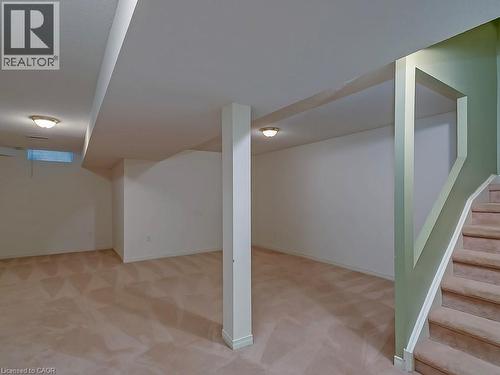 Spacious lower-level area featuring neutral carpeting and light wall finishes - 1310 Blanshard Drive, Burlington, ON - Indoor Photo Showing Other Room