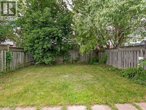 Expansive grassy area bordered by wood fencing - 1310 Blanshard Drive, Burlington, ON - Outdoor With Backyard