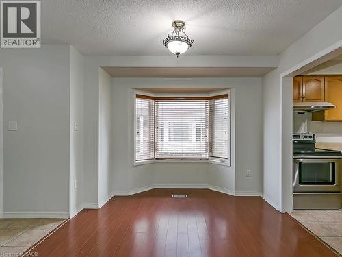 Bay window featuring horizontal blinds and wood-finish flooring - 1310 Blanshard Drive, Burlington, ON - Indoor