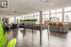 Playroom with dark wood-type flooring - 
