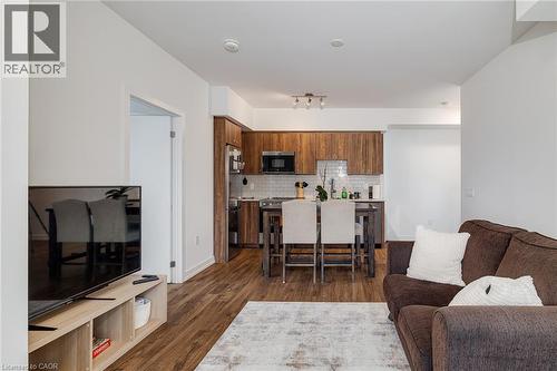 Living room featuring dark hardwood / wood-style floors and sink - 15 Wellington Street S Unit# 1909, Kitchener, ON - Indoor