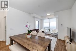 Dining space with hardwood / wood-style flooring - 