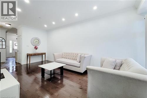Bright interior with rich wood-finish flooring, recessed lighting, and crisp white walls - 232 Stonehenge Drive Unit# 2, Ancaster, ON - Indoor Photo Showing Living Room