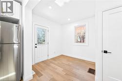 Dining area with wood finished floors recessed lighting - 