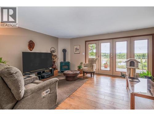 7497 Little Fort 24 Highway, Bridge Lake, BC - Indoor Photo Showing Living Room With Fireplace