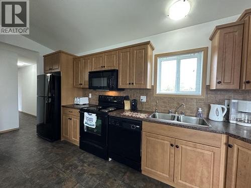 2510 North Bonaparte Road, 70 Mile House, BC - Indoor Photo Showing Kitchen With Double Sink