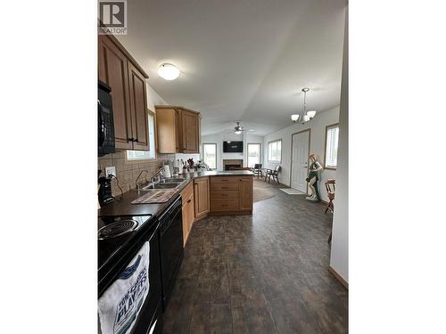 2510 North Bonaparte Road, 70 Mile House, BC - Indoor Photo Showing Kitchen With Double Sink