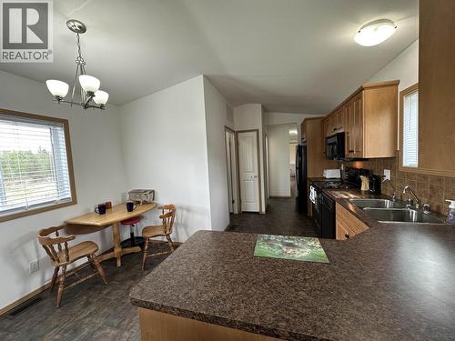 2510 North Bonaparte Road, 70 Mile House, BC - Indoor Photo Showing Kitchen With Double Sink