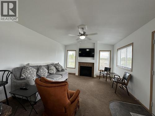 2510 North Bonaparte Road, 70 Mile House, BC - Indoor Photo Showing Living Room With Fireplace