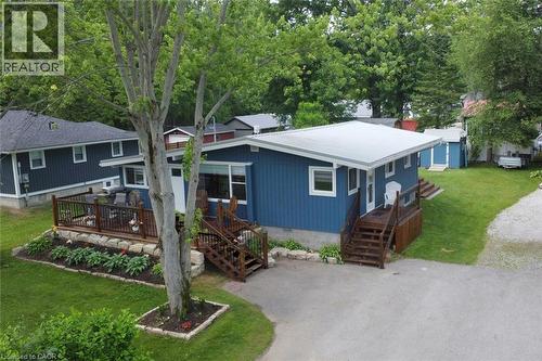 Blue siding exterior with a white trim and a light-colored roof - 5 Ralph Street, Turkey Point, ON - Outdoor