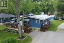 Blue siding exterior with a white trim and a light-colored roof - 5 Ralph Street, Turkey Point, ON  - Outdoor 
