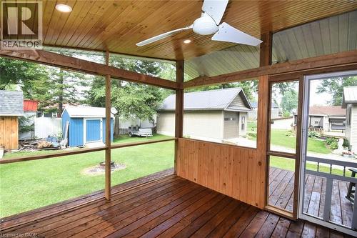 Screened porch featuring a wood-finish ceiling, recessed lighting, and a ceiling fan - 5 Ralph Street, Turkey Point, ON - Outdoor With Deck Patio Veranda With Exterior