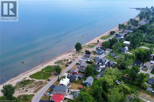 Expansive shoreline and residential properties lining the coast - 5 Ralph Street, Turkey Point, ON - Outdoor With Body Of Water With View