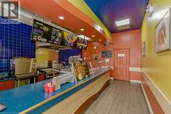 Service counter with blue surfacing and light wood-finish trim - 