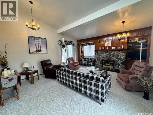 423 7Th Avenue W, Biggar, SK - Indoor Photo Showing Living Room With Fireplace