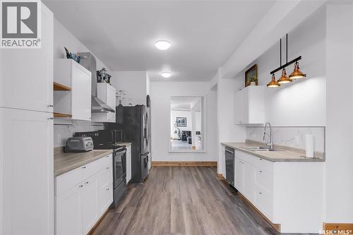310 F Avenue S, Saskatoon, SK - Indoor Photo Showing Kitchen With Double Sink
