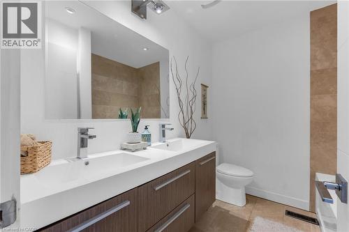 Double vanity with integrated sinks and chrome fixtures - 39 Hilts Drive, Stoney Creek, ON - Indoor Photo Showing Bathroom