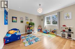 Bright room with wood-finish flooring and neutral wall tones - 