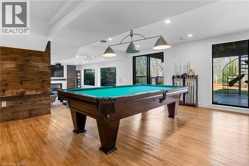 Recreational room with wood-finish flooring, a wood-paneled accent wall, and recessed lighting - 39 Hilts Drive, Stoney Creek, ON - Indoor Photo Showing Other Room