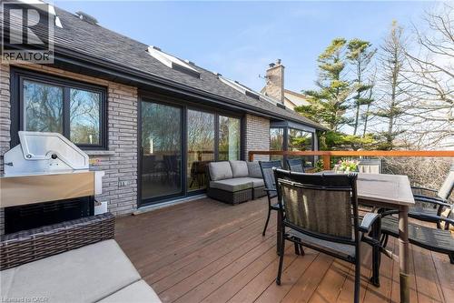 Expansive wood-finish deck with a wood railing, providing ample space for outdoor seating and entertaining - 39 Hilts Drive, Stoney Creek, ON - Outdoor With Deck Patio Veranda With Exterior