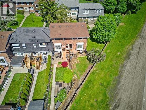 Brick exterior with a brown shingle roof - 26 Coachwood Road Unit# 6, Brantford, ON - Outdoor