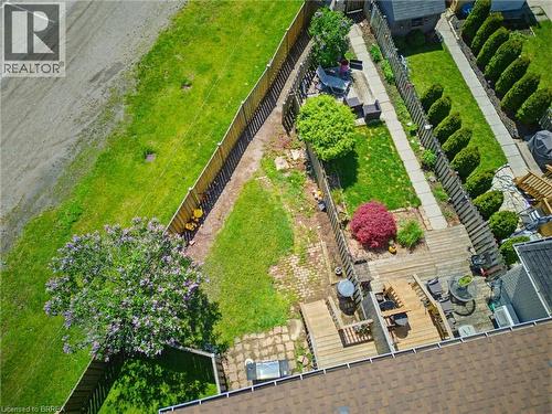 Multi-level wood deck with built-in spa - 26 Coachwood Road Unit# 6, Brantford, ON - 