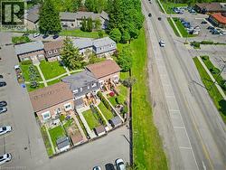 Aerial perspective of a multi-unit property with private rear yards - 