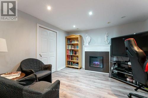 Finished Recreation Room - 66 - 351 Military Trail, Toronto, ON - Indoor With Fireplace
