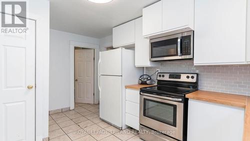 Primary bedroom with large window and closet - 1291 Trafalgar Street, London East (East M), ON - Indoor Photo Showing Kitchen