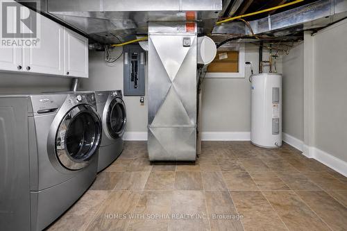 Utility rm /Laundry rm with Sink and cabinets - 162 Glenvale Boulevard, Toronto, ON - Indoor Photo Showing Laundry Room