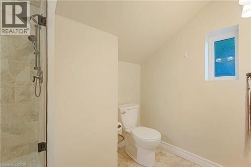 Bathroom with a stall shower and light tile patterned floors - 46 Herkimer Street Unit# 2, Hamilton, ON - Indoor Photo Showing Bathroom