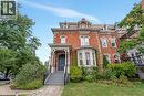 Italianate-style house featuring brick siding and a front lawn - 46 Herkimer Street Unit# 2, Hamilton, ON  - Outdoor With Facade 