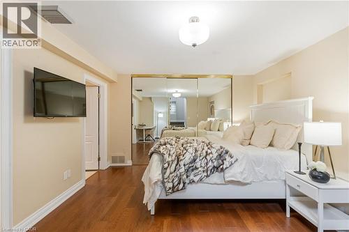 Bedroom with wood finished floors and a closet - 46 Herkimer Street Unit# 2, Hamilton, ON - Indoor Photo Showing Bedroom
