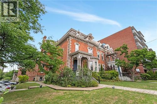 View of front of property featuring brick siding and a front lawn - 46 Herkimer Street Unit# 2, Hamilton, ON - Outdoor
