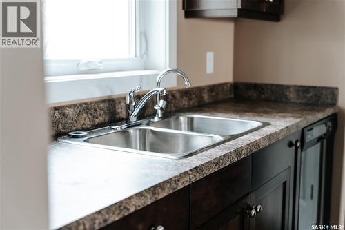 145 Mcintyre Street N, Regina, SK - Indoor Photo Showing Kitchen With Double Sink