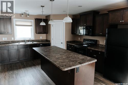 145 Mcintyre Street N, Regina, SK - Indoor Photo Showing Kitchen With Double Sink