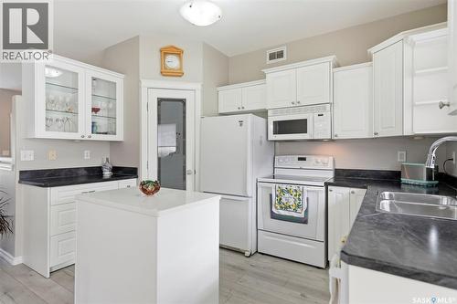 8 320 3Rd Street, Osler, SK - Indoor Photo Showing Kitchen With Double Sink