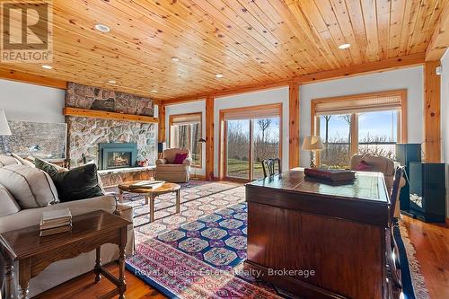 Lower level rec room - 50 Nippissing Ridge Road, Tiny, ON - Indoor Photo Showing Living Room With Fireplace