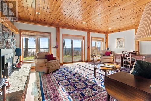 Lower level rec room - 50 Nippissing Ridge Road, Tiny, ON - Indoor Photo Showing Living Room With Fireplace