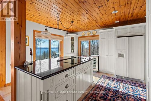 Kitchen - great view and sliding door to main deck - 50 Nippissing Ridge Road, Tiny, ON - Indoor Photo Showing Other Room
