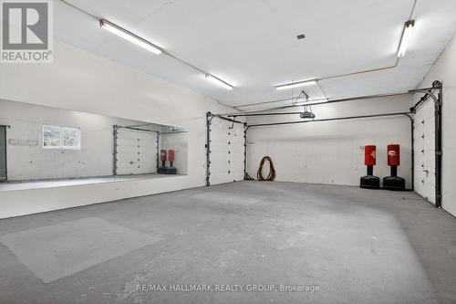 This is the space behind the three garage spaces - 2 Birdstone Avenue, Ottawa, ON - Indoor Photo Showing Garage